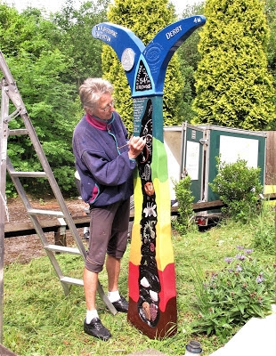 Pat Wilson working on the Mickleover Station milepost – courtesy of Les Sims